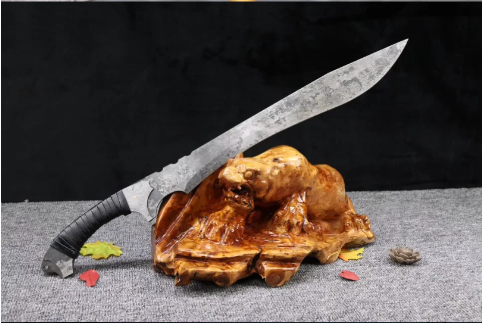 Modern Short Sword A one-handed modern combat sword, displayed leaning against a small wood log.