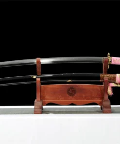 A pink Katana sword saber, displayed next to its scabbard, on a small wooden stand.