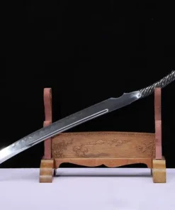 A saber one piece sword, displayed leaning against a small wooden stand.