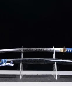 A sharp sword Uchigatana displayed next to its scabbard, on a small stand.