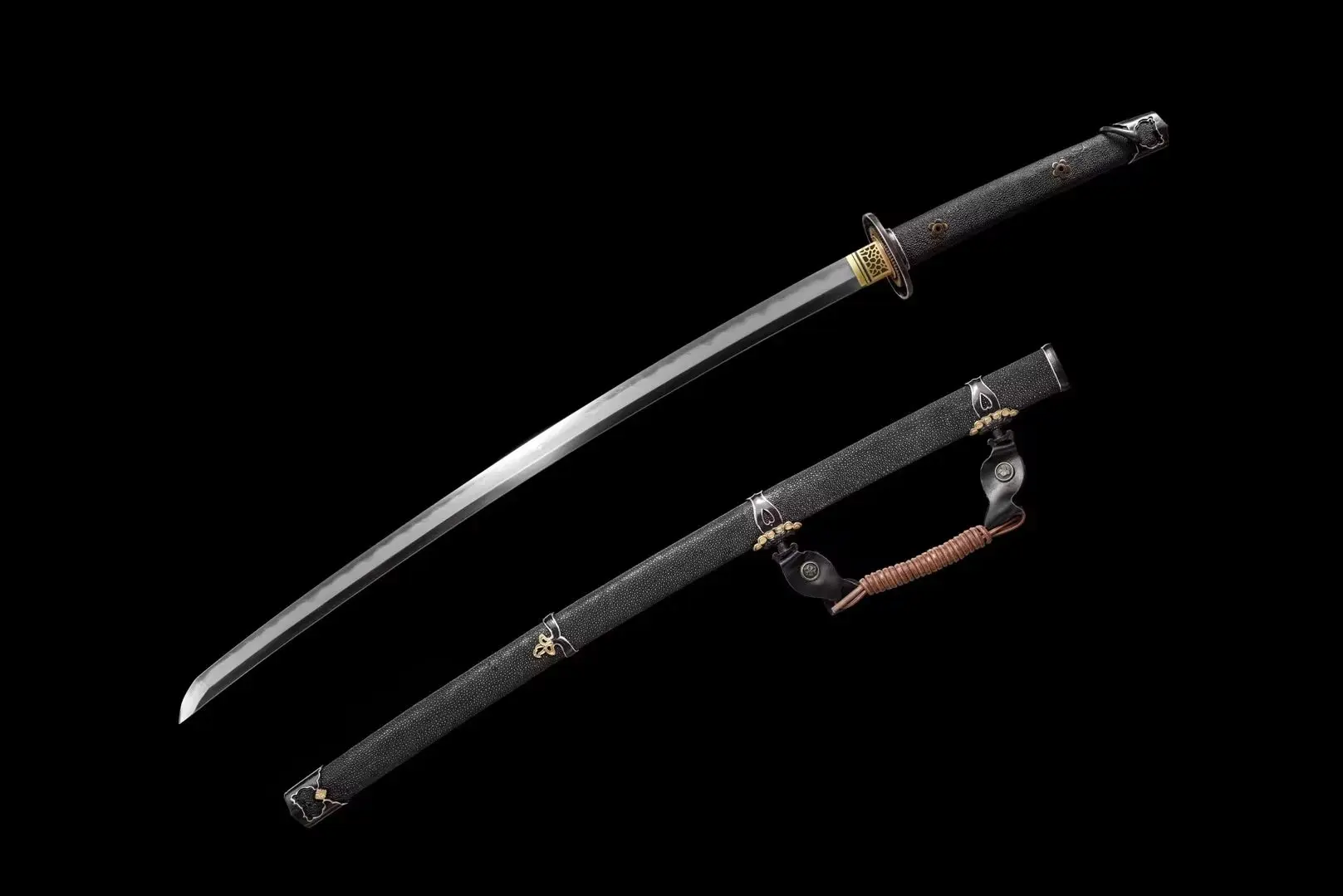 Tachi Weapon A Japanese Tachi weapon sword, displayed next to its black scabbard.
