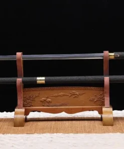 A walking cane with sword, displayed on a small wooden stand next to its stick-scabbard.