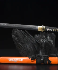 A Japanese Tanto point knife, displayed on top of a small wood log, with its scabba