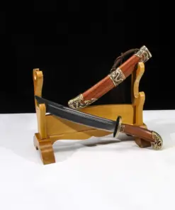 A Chinese traditional knife displayed next to its decorative scabbard, leaning against a small wooden stand.