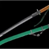 A Chinese Yanmaodao sword, displayed next to its decorative scabbard.