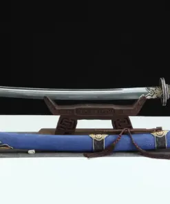 A Chinese sword saber displayed on a small wooden stand, with its decorative scabbard below.