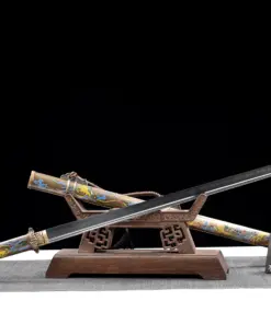 A Chinese Tang Dao sword displayed crossed against its decorative scabbard, leaning against a small wooden stand.