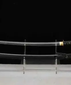 A Katana black sword displayed next to its scabbard, on a small stand.