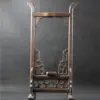 A wooden upright sword stand display.