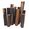 Multiple blocks of African blackwood of differing sizes.