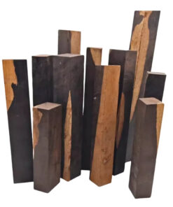 Multiple blocks of African blackwood of differing sizes.