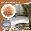 A red bird bath copper disk, with a use-case example of a bird using a bird bath with a pure copper disk.
