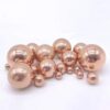 Solid copper ball spheres of varying sizes.