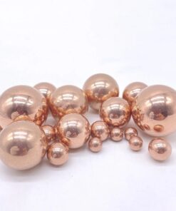 Solid copper ball spheres of varying sizes.