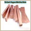 Multiple red copper bars and flats of differing sizes.
