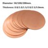 Multiple red copper disk plates.