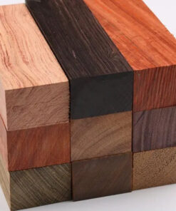 Nine species of exotic timber wood blocks, stacked in a neat pile.