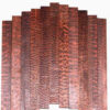 Multiple boards of snakewood timber.