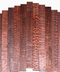 Multiple boards of snakewood timber.