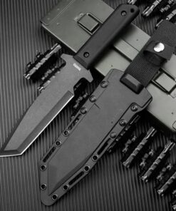 A black tactical Tanto knife displayed next to its sheath.