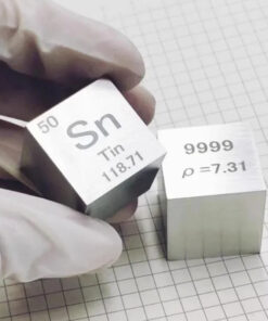 A man's hand holding a science periodic-table pure tin cube block