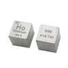 Two holmium metal cubes.