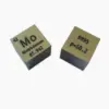 Two pure molybdenum metal cube samples.