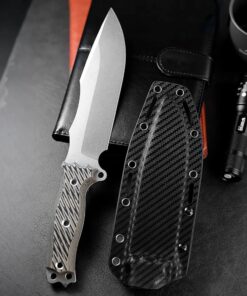 An outdoor survival knife displayed next to its sheath.