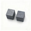 Two pure tellurium metal cube samples.