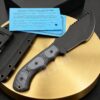 A survival tracker knife displayed next to its Kydex sheath.