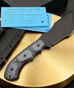 A survival tracker knife displayed next to its Kydex sheath.