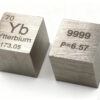 Two pure ytterbium metal cubes.