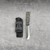 A fixed blade bushcraft knife displayed next to its Kydex sheath.