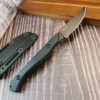 A game caping knife, displayed next to its Kydex sheath.