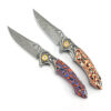 Two Damascus steel pocket folding colorful knives.
