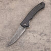 A folding Damascus blade pocket knife.