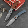 A Damasuc steel folding knife.