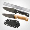 Two bushcraft drop point knife models, displayed next to a stel ruler and a Kydex sheath.