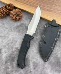A fixed blade field knife, displayed next to its Kydex sheath.