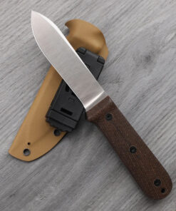 A fieldcraft knife displayed leaning against its Kydex sheath.