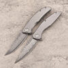 Two folding Damascus knife models.