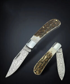 A horn handle pocket Damascus knife.