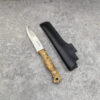 A bushcraft wooden handle knife, displayed next to its sheath.