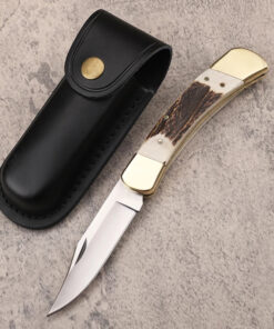 A folding lockback knife, displayed next to its leather knife pouch.