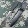 A Russian army knife displayed next to its sheath.