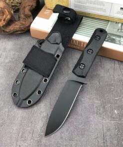 A small fixed blade knife displayed next to its sheath.