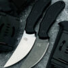 Two small skinning knife models displayed next to a Kydext sheath.