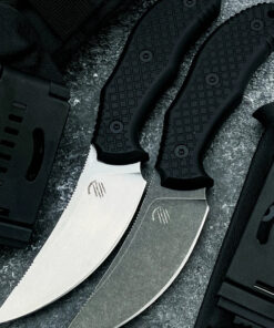 Two small skinning knife models displayed next to a Kydext sheath.