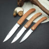 Three wod handle pocket knife models of differing size.