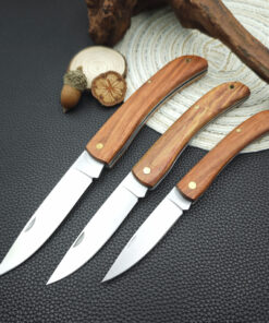 Three wod handle pocket knife models of differing size.